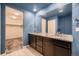 Double vanity bathroom with granite countertop at 9307 Inca Dove Cir, Littleton, CO 80125