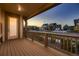 Relaxing covered porch with wooden deck and neighborhood views at 9307 Inca Dove Cir, Littleton, CO 80125
