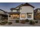 Two-story Craftsman home with light-colored siding and a front porch at 9307 Inca Dove Cir, Littleton, CO 80125