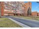 Brick building exterior with landscaping and parking at 1850 Folsom St # 411, Boulder, CO 80302