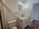 Modern bathroom with white vanity and black fixtures at 69345 County Road 34, Byers, CO 80103