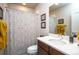 Clean bathroom with a shower/tub combo, updated vanity, and fresh towels at 13778 Umatilla Ln, Broomfield, CO 80023