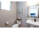 Small powder room with pedestal sink and toilet at 13778 Umatilla Ln, Broomfield, CO 80023