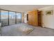 Bright living room with city views and built-in shelving at 1020 15Th St # 25F, Denver, CO 80202