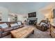 Cozy living room with leather sofas and fireplace at 419 Johnson Dr, Castle Rock, CO 80104