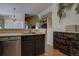 Modern kitchen with stainless steel appliances and island at 6945 S Dover Way, Littleton, CO 80128