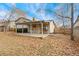 House with covered patio and spacious backyard at 8471 Yarrow St, Arvada, CO 80005