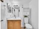 Clean bathroom with wood vanity and toilet at 14751 E Tennessee Dr # 225, Aurora, CO 80012
