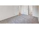 Bright bedroom with gray carpet, double doors to bathroom, and ample closet space at 14751 E Tennessee Dr # 225, Aurora, CO 80012