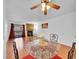 Dining area with glass table and red chairs near living room at 14751 E Tennessee Dr # 225, Aurora, CO 80012