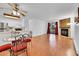 Dining area with glass table and red chairs, open to kitchen at 14751 E Tennessee Dr # 225, Aurora, CO 80012