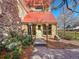 Building entrance with landscaping at 14751 E Tennessee Dr # 225, Aurora, CO 80012