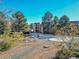 Exterior view of condo building with landscaping and parking at 14751 E Tennessee Dr # 225, Aurora, CO 80012