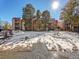 Building exterior with snow covered courtyard at 14751 E Tennessee Dr # 225, Aurora, CO 80012