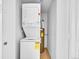 Stackable washer and dryer in laundry closet at 14751 E Tennessee Dr # 225, Aurora, CO 80012