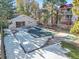 Community pool and patio area with surrounding snow at 14751 E Tennessee Dr # 225, Aurora, CO 80012