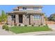 Two-story house with stone and siding exterior at 15004 W 63Rd Ave, Arvada, CO 80403