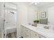 Clean bathroom with double vanity and a separate tub/shower at 10250 Dan Ct, Highlands Ranch, CO 80130