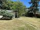 Landscaped backyard with shed and grassy area at 2696 S Jersey St, Denver, CO 80222