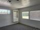 Bright living room featuring built-in shelving and neutral carpeting at 2696 S Jersey St, Denver, CO 80222