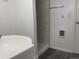 Clean bathroom with shower stall, vanity, and updated flooring at 2696 S Jersey St, Denver, CO 80222