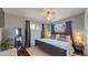 Main bedroom with king bed and ceiling fan at 28 W Broadmoor Dr, Littleton, CO 80120