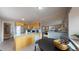 Open concept kitchen featuring wood cabinets and a breakfast bar at 28 W Broadmoor Dr, Littleton, CO 80120