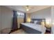Spacious bedroom with king-size bed and ceiling fan at 28 W Broadmoor Dr, Littleton, CO 80120