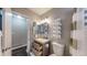 Clean bathroom with updated vanity and storage at 28 W Broadmoor Dr, Littleton, CO 80120