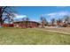 Brick ranch home with a well-maintained lawn at 28 W Broadmoor Dr, Littleton, CO 80120