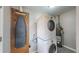 Convenient laundry area with washer, dryer, and ironing board at 28 W Broadmoor Dr, Littleton, CO 80120