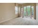 Spacious bedroom with plush carpeting and access to a private balcony at 1488 Madison St # 211, Denver, CO 80206