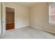 Carpeted bedroom with neutral walls and an open doorway to the living area at 1488 Madison St # 211, Denver, CO 80206