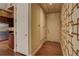 Entryway with wood floors and a geometric patterned wall at 1488 Madison St # 211, Denver, CO 80206