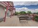 Spacious rooftop deck with seating area, offering city views at 1488 Madison St # 211, Denver, CO 80206