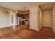 Open concept living and kitchen area with wood floors and modern appliances at 1488 Madison St # 211, Denver, CO 80206