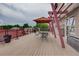 Rooftop deck features a pergola, table and chairs, and gas grill at 1488 Madison St # 211, Denver, CO 80206