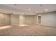 Spacious unfinished basement with neutral walls and carpet at 12388 E Caspian Dr, Aurora, CO 80014