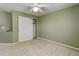 Bedroom with ceiling fan and double door closet at 12388 E Caspian Dr, Aurora, CO 80014