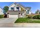 Two-story house with attached garage and landscaped lawn at 1743 Brookside Dr, Highlands Ranch, CO 80126