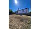 Landscaped backyard with elevated ground at 19973 E Dartmouth Ave, Aurora, CO 80013