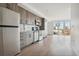Modern kitchen with stainless steel appliances and wood cabinets at 3575 Chestnut Pl # 601, Denver, CO 80216