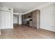 Open living room with hardwood floors and modern kitchen at 3575 Chestnut Pl # 601, Denver, CO 80216