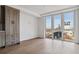 Bright living room with large windows and hardwood floors at 3575 Chestnut Pl # 601, Denver, CO 80216