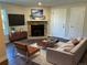 Living room with corner fireplace, hardwood floors, and a neutral color palette at 909 S Dawson Way # 2, Aurora, CO 80012