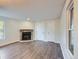 Living room with stone fireplace and hardwood floors at 909 S Dawson Way # 2, Aurora, CO 80012