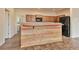 Kitchen island with multicolored wood facade and granite countertop at 221 Westin Ave, Brighton, CO 80603