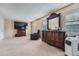 Bright bedroom featuring a large TV, comfortable armchair, and ample dresser space at 1099 S Naples Way, Aurora, CO 80017