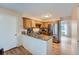 Galley kitchen with granite countertops and wood cabinets at 1099 S Naples Way, Aurora, CO 80017