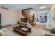 Spacious living room with hardwood floors and staircase at 1099 S Naples Way, Aurora, CO 80017